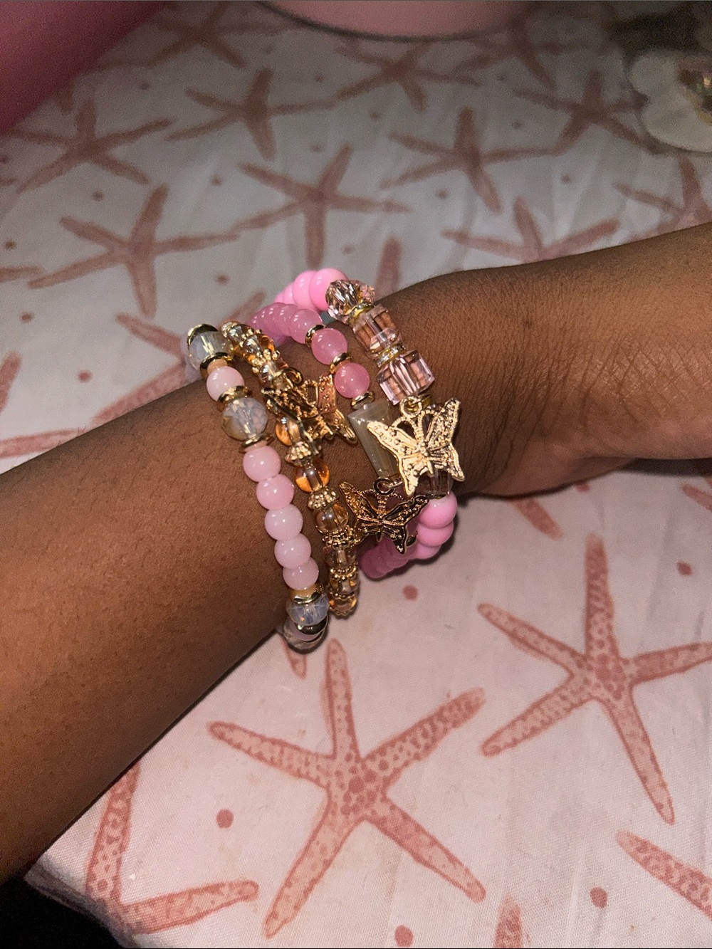 Pink Beaded Bracelet Stack with Gold Butterfly Charms